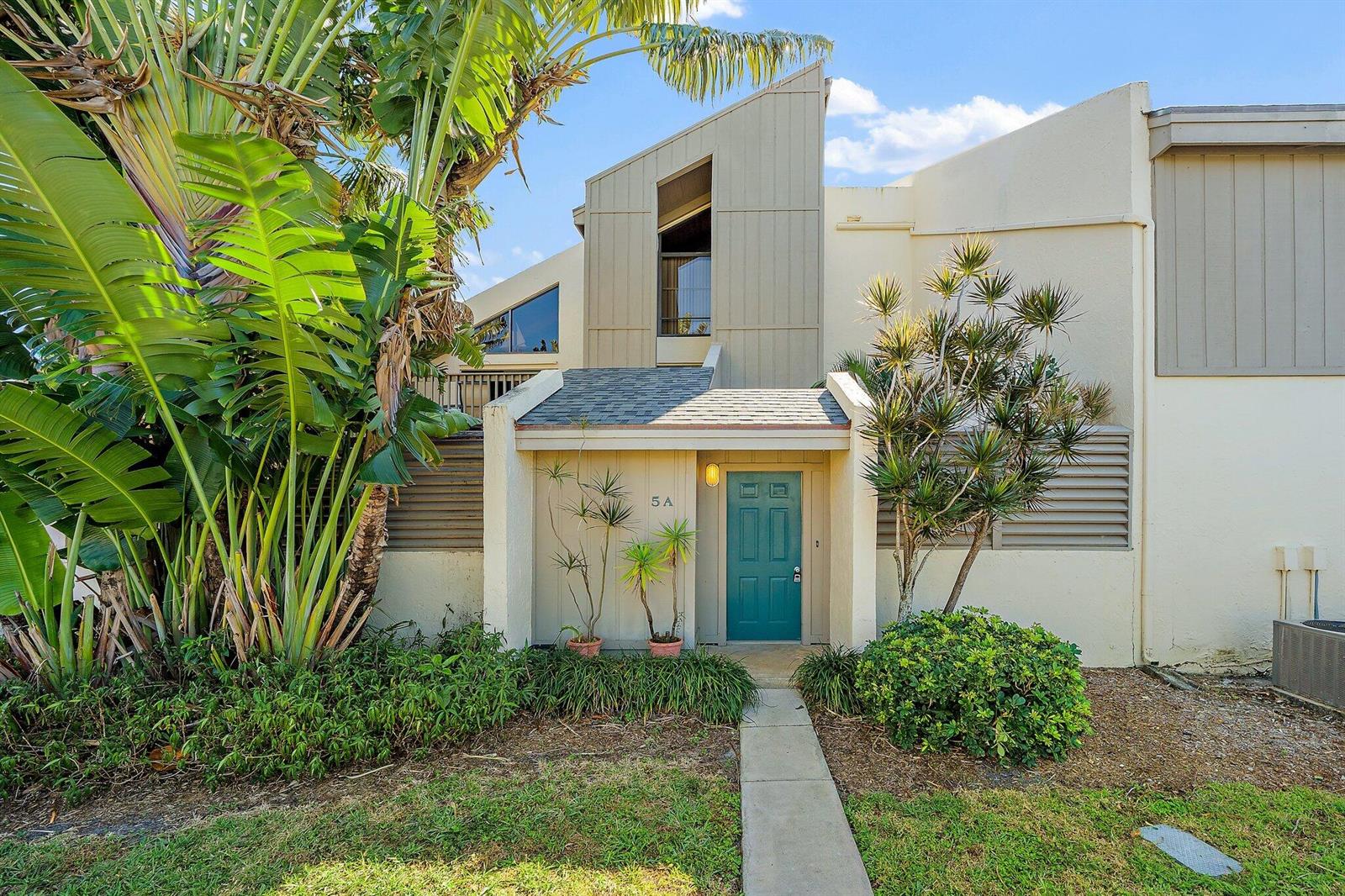 A teal front door with the number 5A sits under a small roofed entryway — 1605 S Us Highway 1 # 5a, Jupiter FL 33477, JUPITER, FL