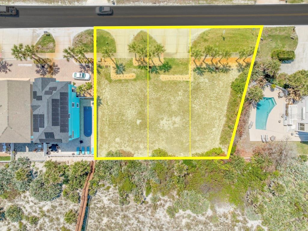 An aerial view shows three adjacent vacant beachfront lots outlined in yellow — 4873 S ATLANTIC AVENUE, PONCE INLET, FL