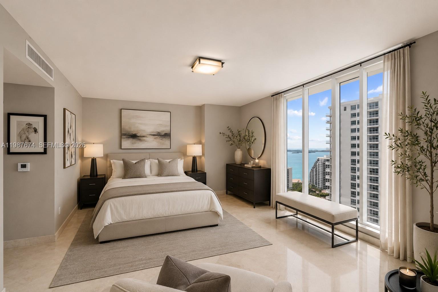A bedroom features a bed, dresser, and floor-to-ceiling windows overlooking the ocean and city — 901 Brickell Key Blvd # 2804, Miami FL 33131, MIAMI, FL