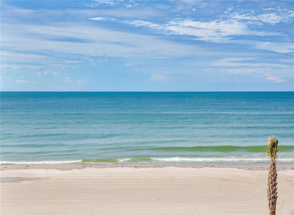 A view of a sandy beach and the ocean under a blue sky — 17450 GULF BOULEVARD UNIT 206, REDINGTON SHORES, FL