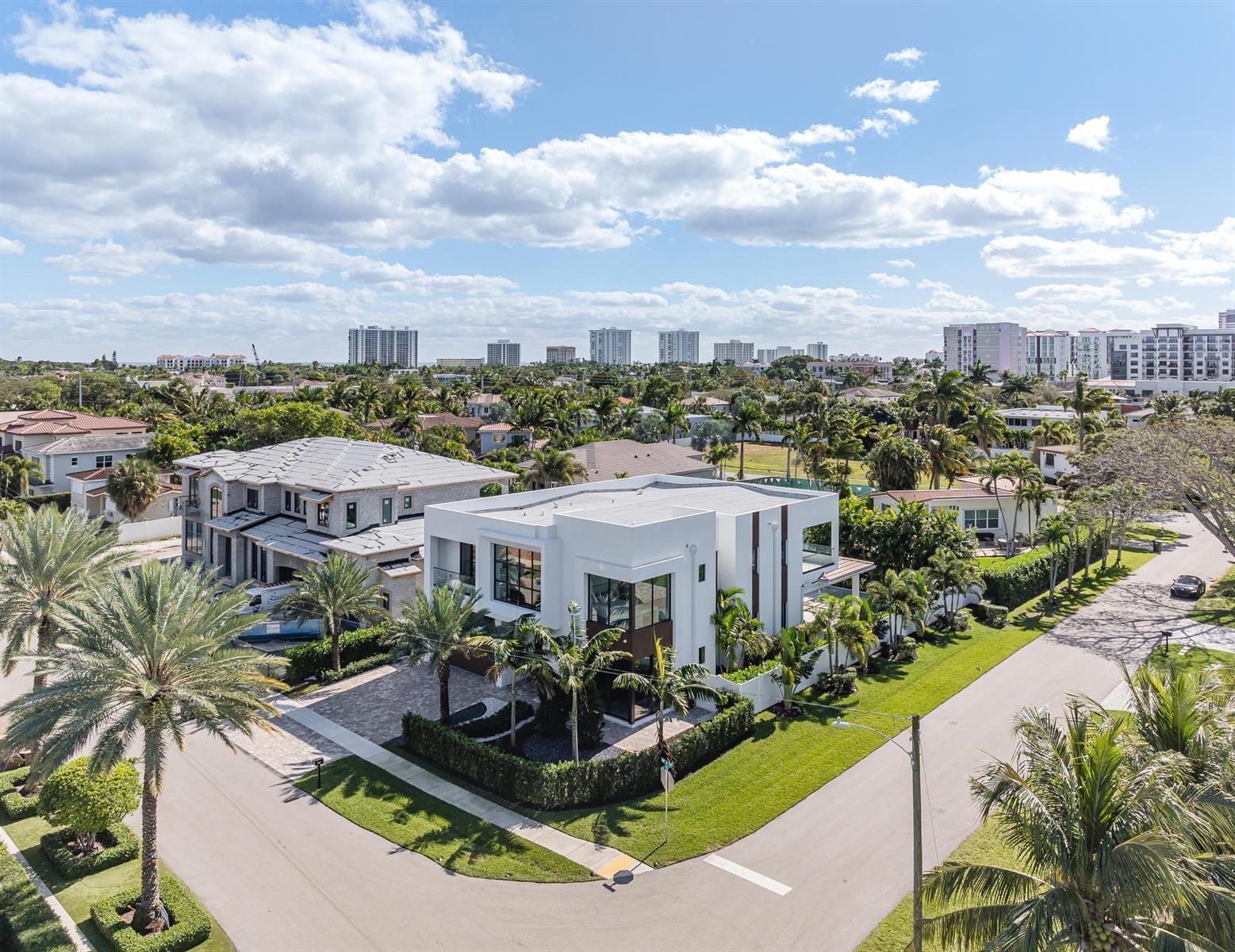 An aerial view shows a modern white house and a neighboring home under construction — 400 NE 4th Street, Boca Raton FL 33432, BOCA RATON, FL