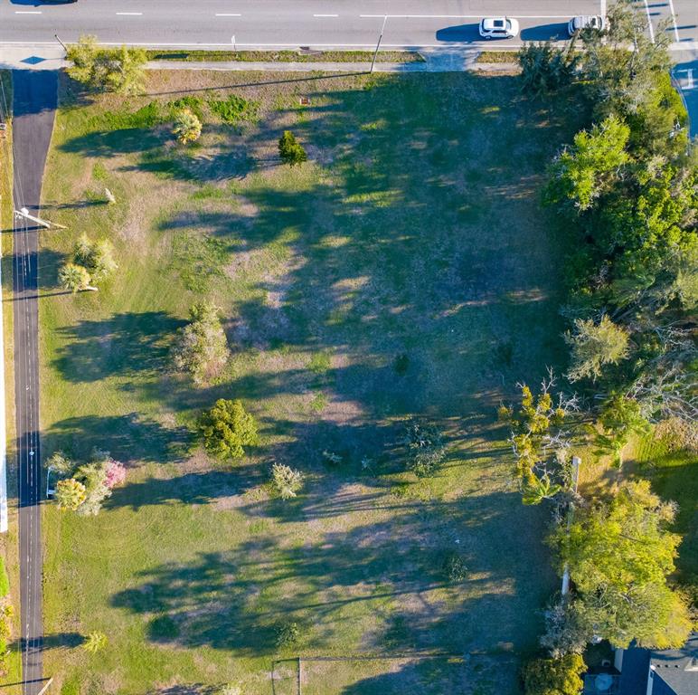 An aerial view of a large lake surrounded by residential neighborhoods and a main road — 2125 W BEARSS AVENUE, TAMPA, FL