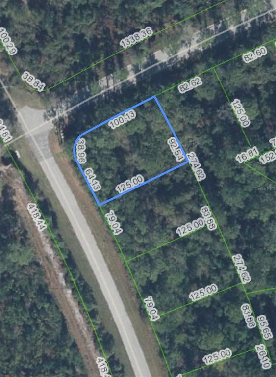 An aerial view shows a vacant, wooded lot outlined in blue with property boundary dimensions — 7191 COLUMBUS BOULEVARD, SEBRING, FL