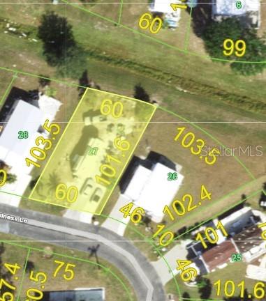 This is an aerial map showing property lot lines and dimensions for a residential area — 7416 WIDNESS LANE, PORT CHARLOTTE, FL