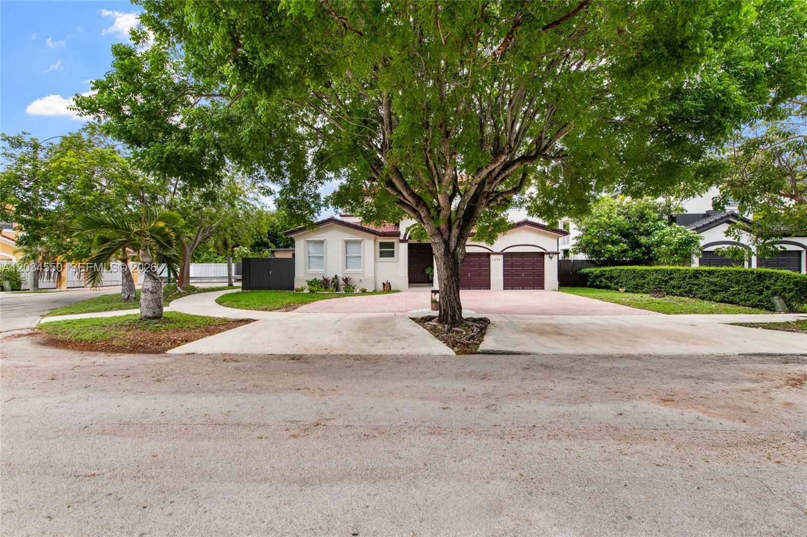 A single-story house with a two-car garage and a large tree in the front yard — 15761 SW 59th Ter, Miami FL 33193, MIAMI, FL