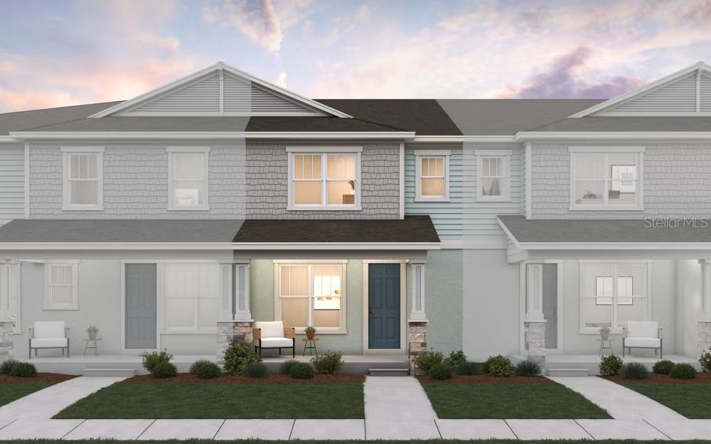 A digital rendering of a two-story townhouse exterior with a blue door and stone accents — 17007 HAGGERTY HOLLOW DRIVE, WINTER GARDEN, FL