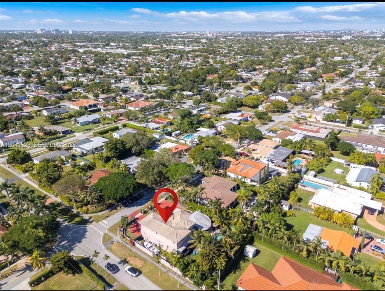 An aerial view shows a two-story house with a red-tiled roof in a residential neighborhood — 3135 SW 80th Ave, Miami FL 33155, MIAMI, FL