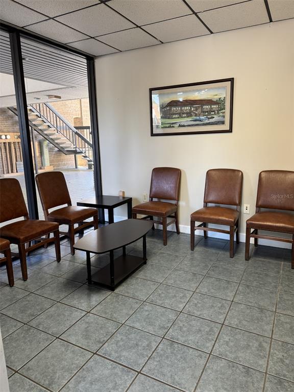 A waiting room features brown leather chairs, a small coffee table, and tiled flooring — 2226 E SILVER SPRINGS BOULEVARD UNIT Suite C, OCALA, FL