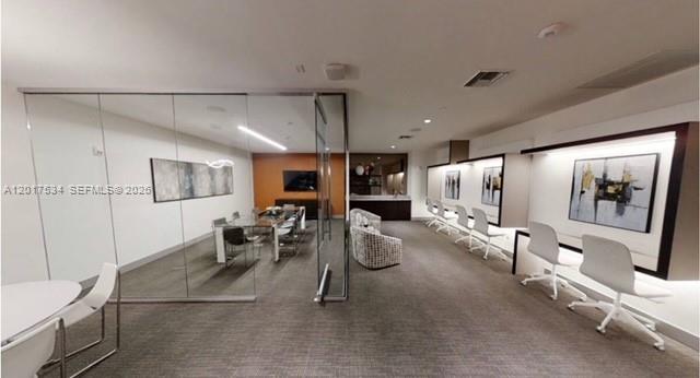 A modern office space features a glass-enclosed conference room and a row of individual workstations — 5350 NW 84th Ave # 1613, Doral FL 33166, DORAL, FL
