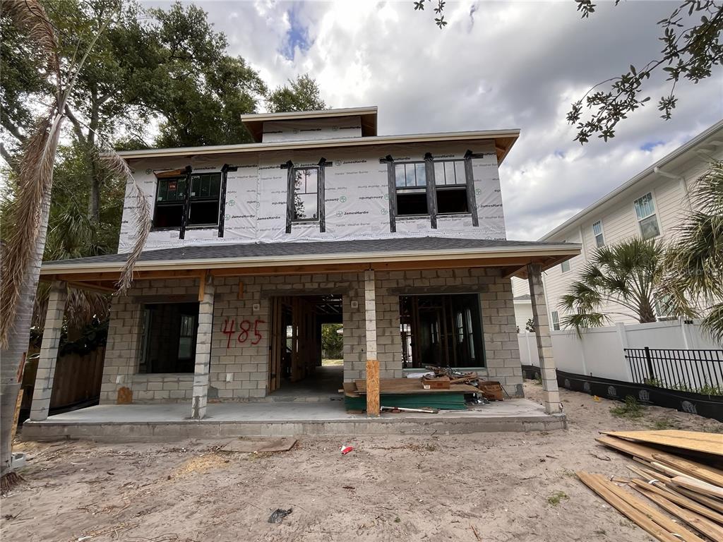 A two-story house under construction features a concrete block first floor and wood-framed upper level — 485 11TH AVENUE N, ST PETERSBURG, FL