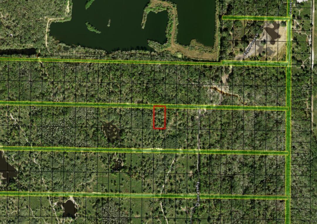 An aerial map shows a rectangular property outlined in red within a wooded area — 0 County Rd 54, FL 33849, FL