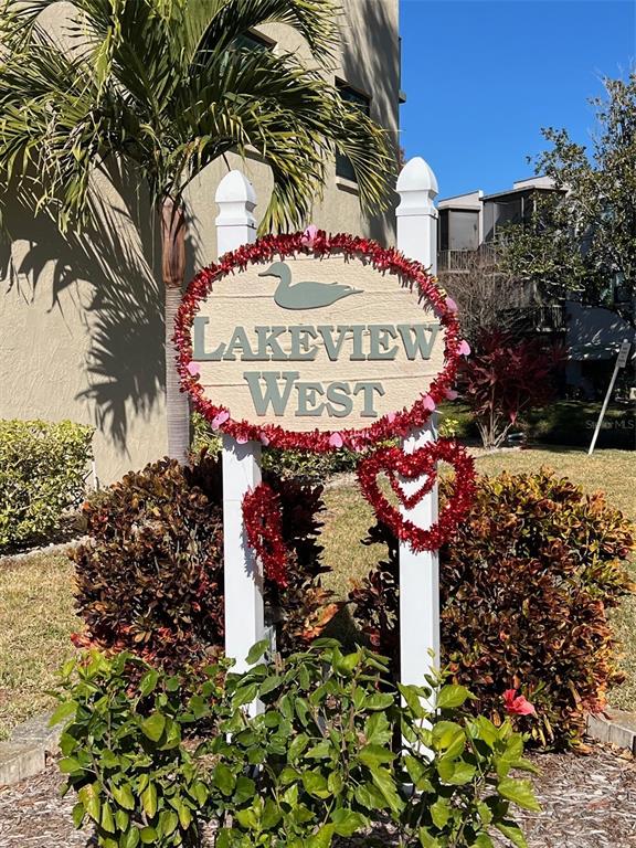 A sign for Lakeview West stands in front of a building and landscaping — 7951 58TH AVENUE N UNIT 207, ST PETERSBURG, FL
