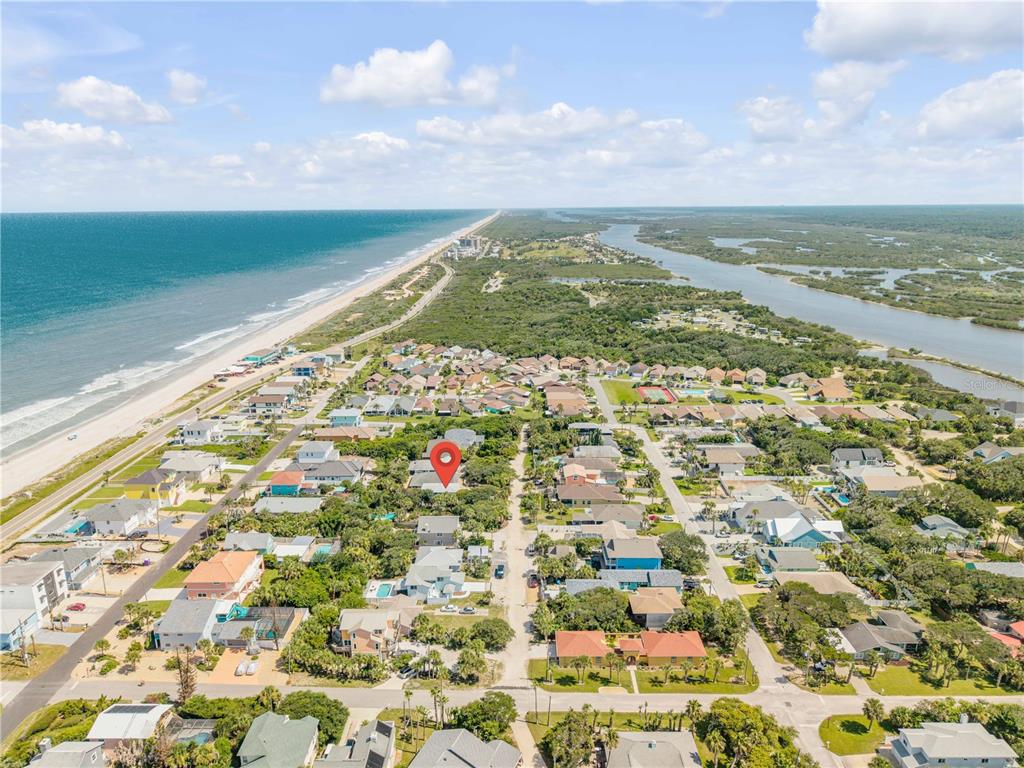 An aerial view shows a coastal neighborhood with a red location pin on a house — 2722 ANNETTE STREET, FLAGLER BEACH, FL