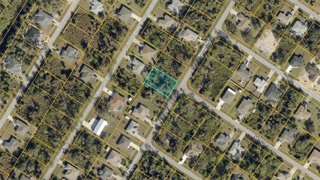 This is an aerial map view of a vacant residential lot outlined in light blue — RHUMBA TERRACE Lot 29, NORTH PORT, FL