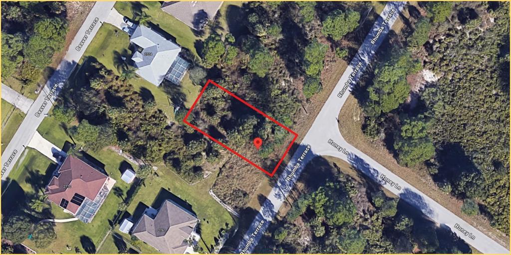 This satellite map shows a vacant, rectangular residential lot located at a street intersection — RHUMBA TERRACE Lot 29, NORTH PORT, FL