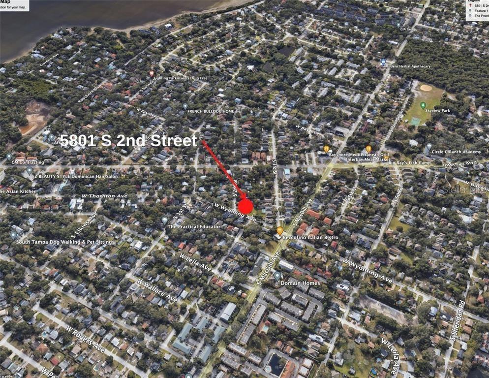 This is an aerial map view of a residential neighborhood with a highlighted property location — 5801 S 2ND STREET, TAMPA, FL