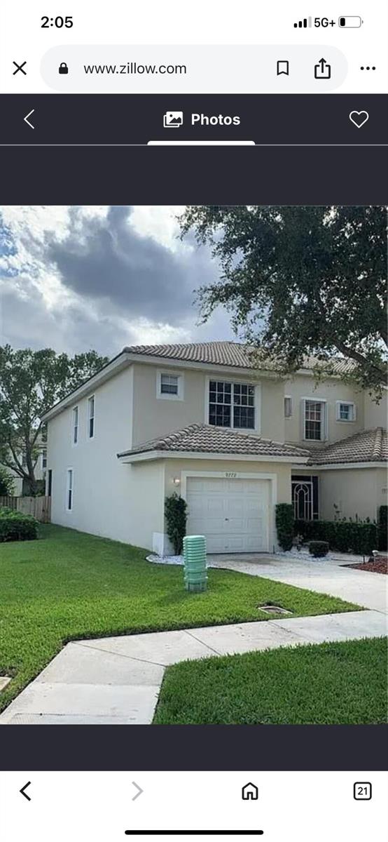 A two-story house with a beige stucco exterior, a tile roof, and a single-car garage — 9772 Porta Leona Lane, Boynton Beach FL 33472, BOYNTON BEACH, FL