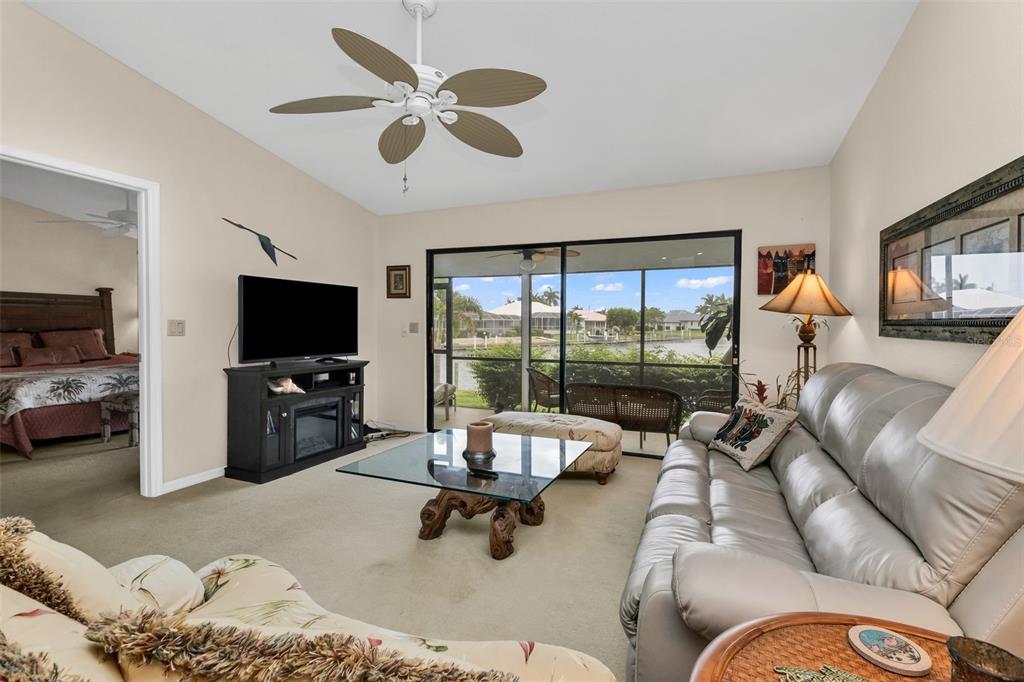 An aerial view of a house with a red tile roof, garage, and swimming pool — 3830 BAL HARBOR BOULEVARD UNIT #15, PUNTA GORDA, FL