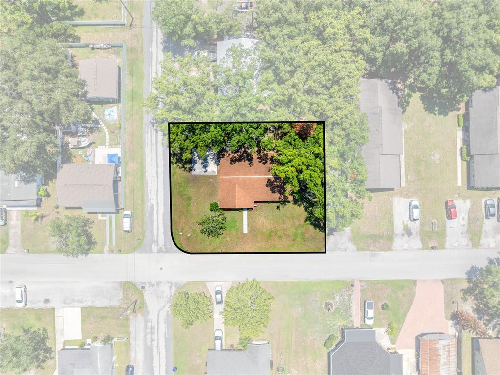 This is an aerial view of a residential property with a house and yard — 1501 VIRGINIA AVENUE, ST CLOUD, FL