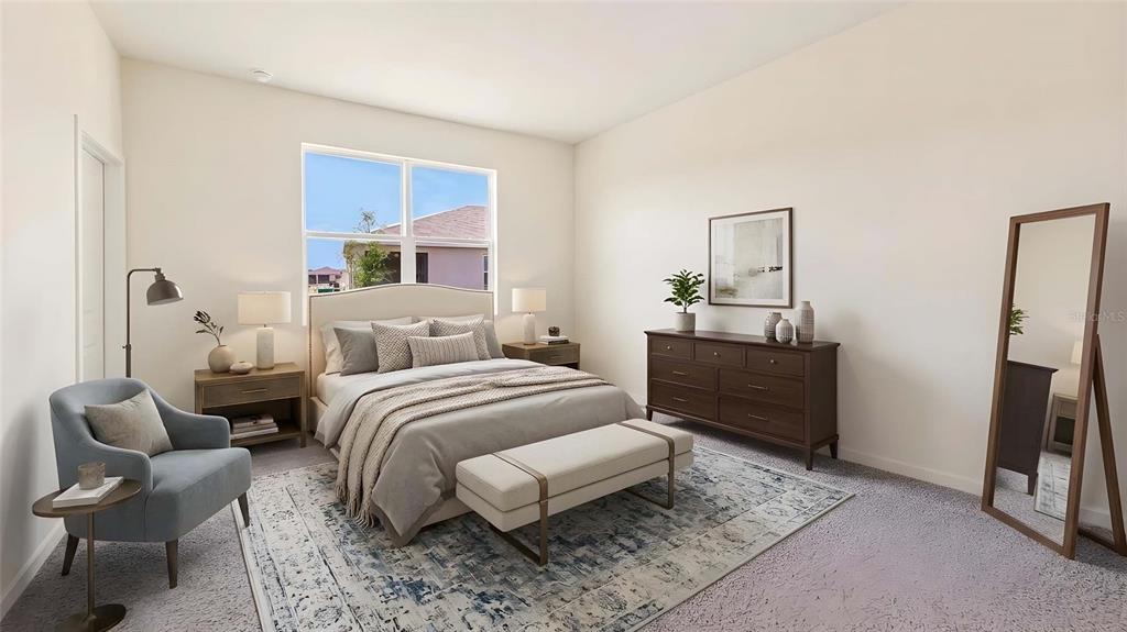 This bedroom features a bed, a blue armchair, a wooden dresser, and a floor mirror — 3022 CANOPY OAK BOULEVARD, WILDWOOD, FL
