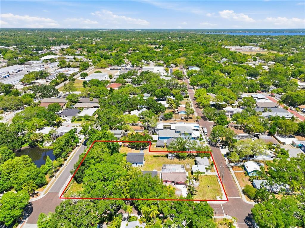 An aerial view shows a residential lot outlined in red with several small houses — 2ND STREET N, SAFETY HARBOR, FL