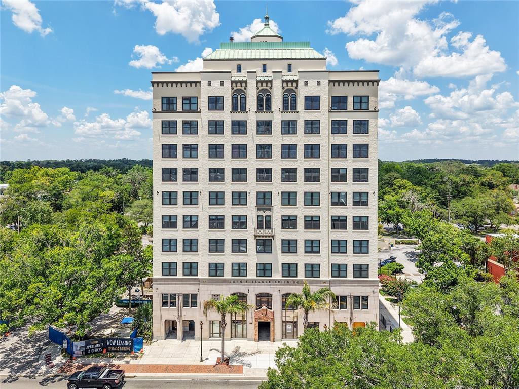 An aerial view of the historic John F. Seagle Building surrounded by lush green trees — 408 W UNIVERSITY AVENUE UNIT 7B, GAINESVILLE, FL
