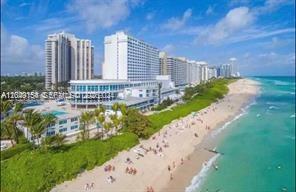 An aerial view of a large beachfront hotel complex with a sandy beach and ocean — 5445 Collins Ave # 721, Miami Beach FL 33140, MIAMI BEACH, FL