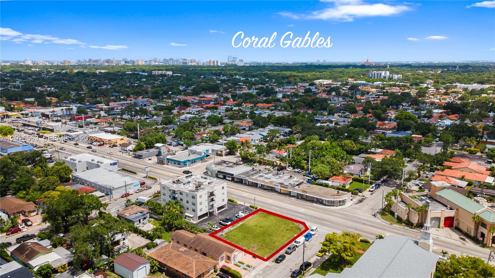 An aerial view shows a vacant rectangular lot outlined in red within a suburban neighborhood — 5895 W Flagler St, Miami FL 33144, MIAMI, FL