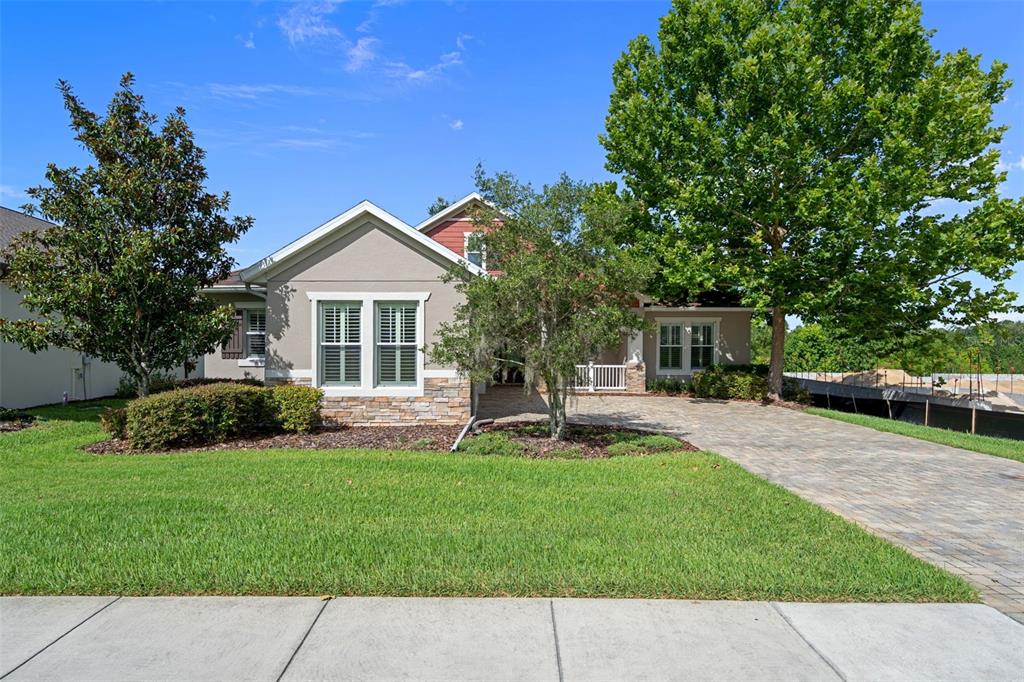 A screened-in patio with paver flooring, a ceiling fan, and a view of the yard — 4551 SOUTHERN VALLEY LOOP, BROOKSVILLE, FL