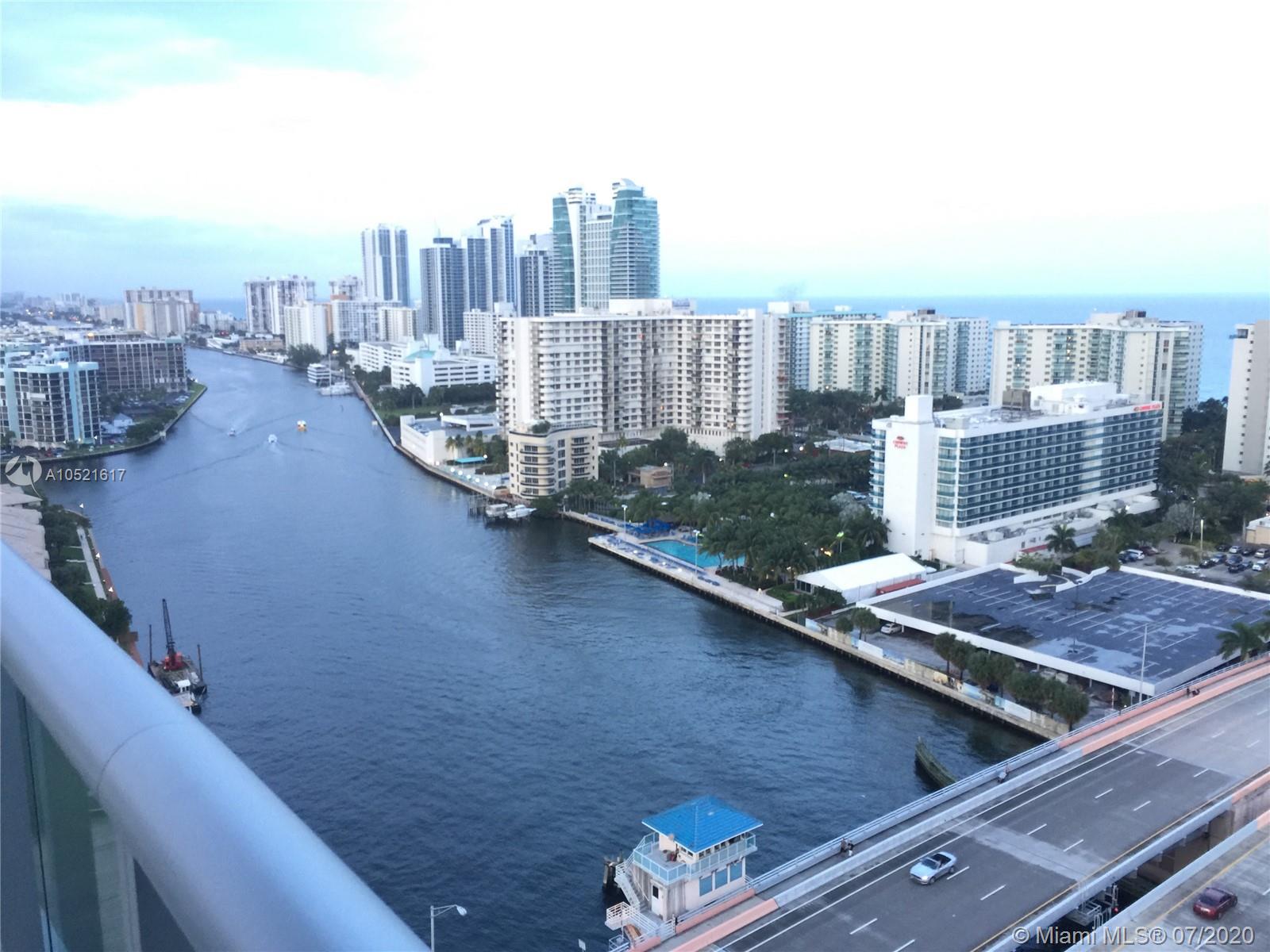 An elevated view of a waterway flowing between high-rise buildings and a bridge — 2600 E Hallandale Beach # 2202, Hallandale Beach FL 33009, HALLANDALE BEACH, FL
