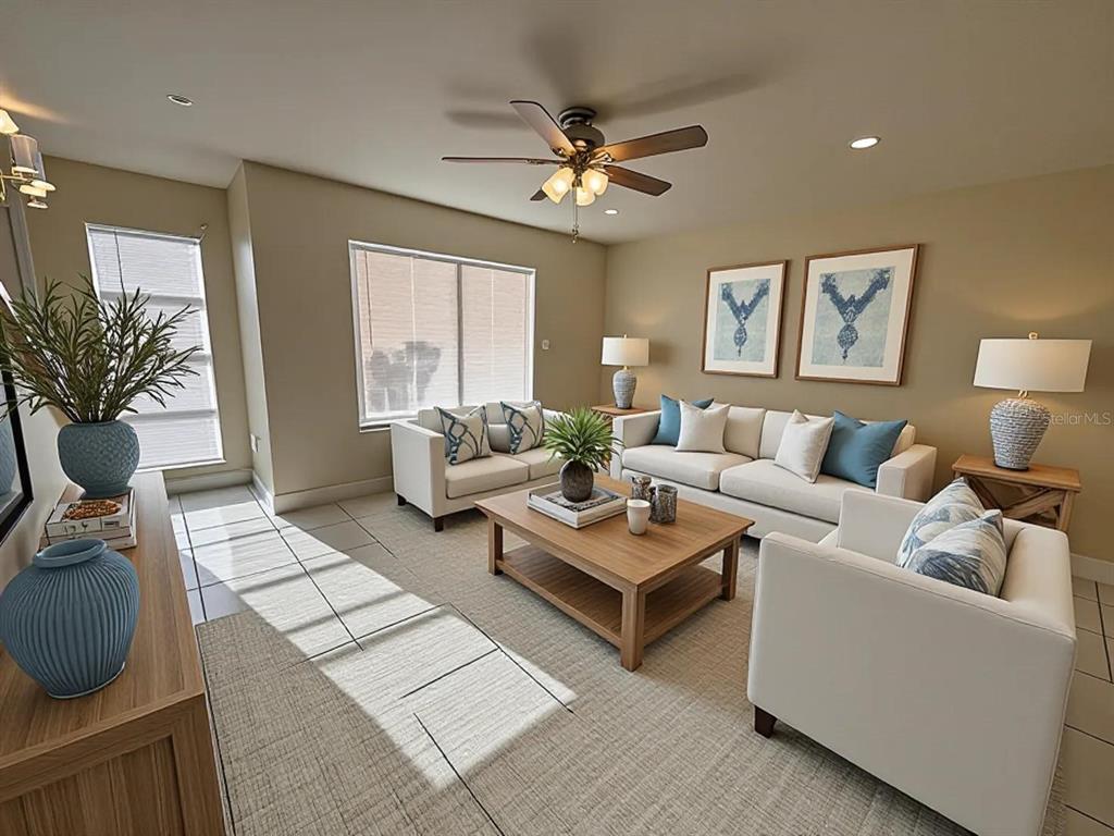 A living room features white sofas, a wooden coffee table, and blue accent decor — 4033 HENLEY ROAD UNIT 1707, ORLANDO, FL