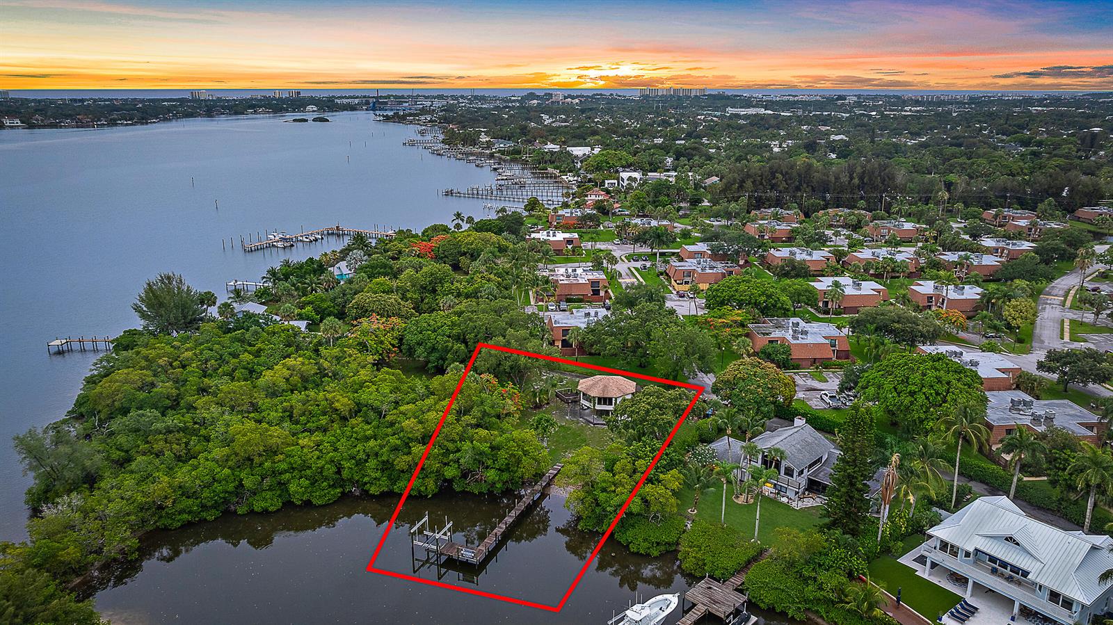 An aerial view shows a waterfront property with a private dock and gazebo outlined in red — 18189 49th Terrace, Jupiter FL 33458, JUPITER, FL