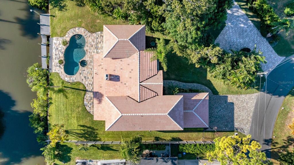 An aerial view shows a residential neighborhood near a large body of water — 7300 COVE TERRACE, SARASOTA, FL