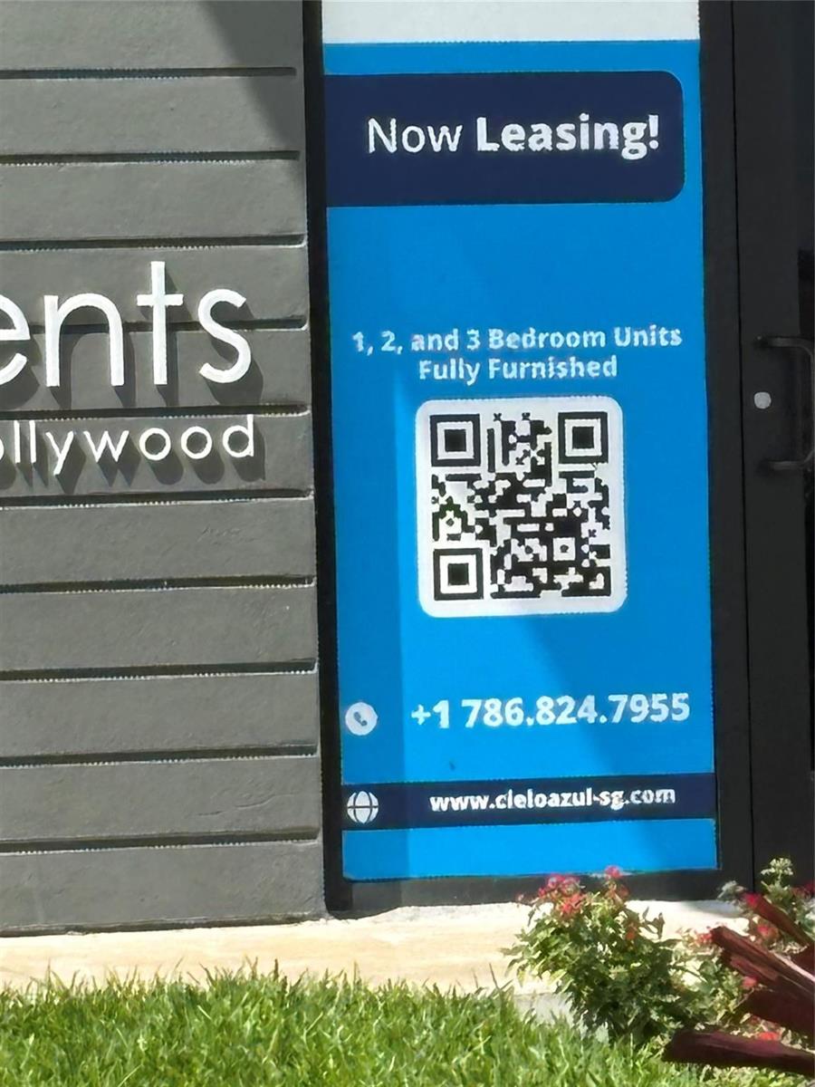A sign advertises fully furnished one, two, and three-bedroom apartment units with a QR code — 2117 Polk Street, Hollywood FL 33020, HOLLYWOOD, FL