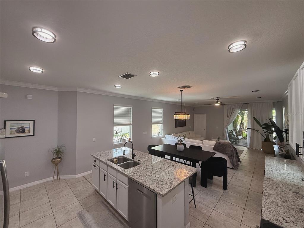 An aerial view shows a community clubhouse with a swimming pool and playground nearby — 5253 SUNCATCHER DRIVE, WESLEY CHAPEL, FL