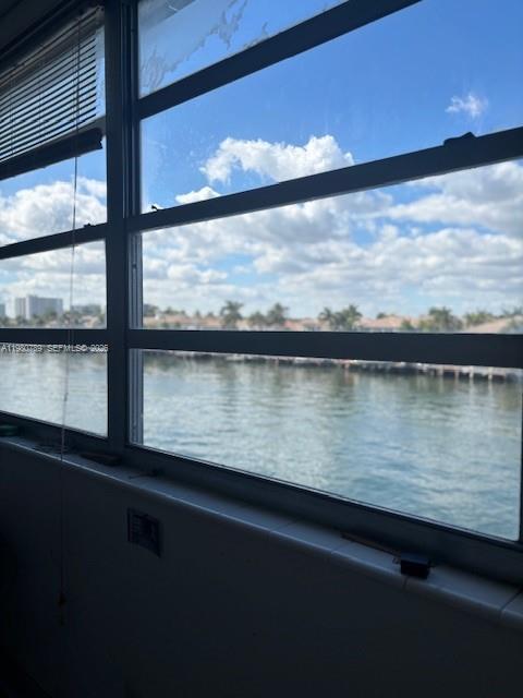 A view of a waterway and distant buildings through a multi-pane window — 1400 S Ocean Dr # 304, Hollywood FL 33019, HOLLYWOOD, FL
