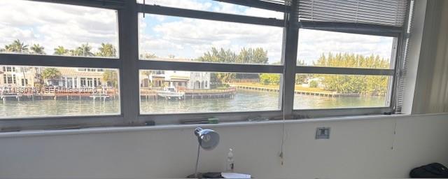 A view of a waterway and houses through a large multi-pane window in a room — 1400 S Ocean Dr # 304, Hollywood FL 33019, HOLLYWOOD, FL