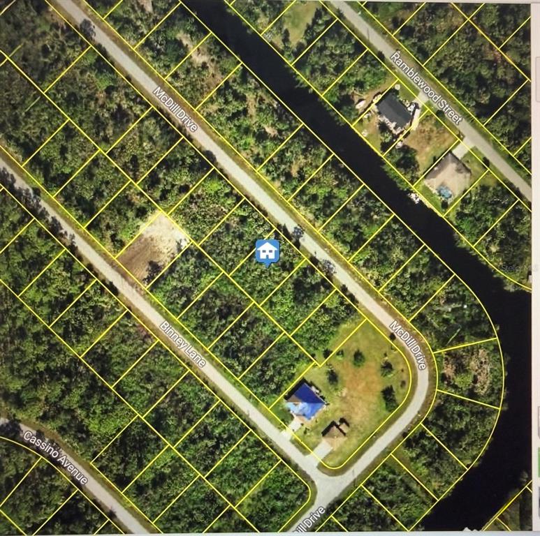 This is an aerial map showing a vacant lot marked with a house icon — 520 MCDILL DRIVE, PORT CHARLOTTE, FL