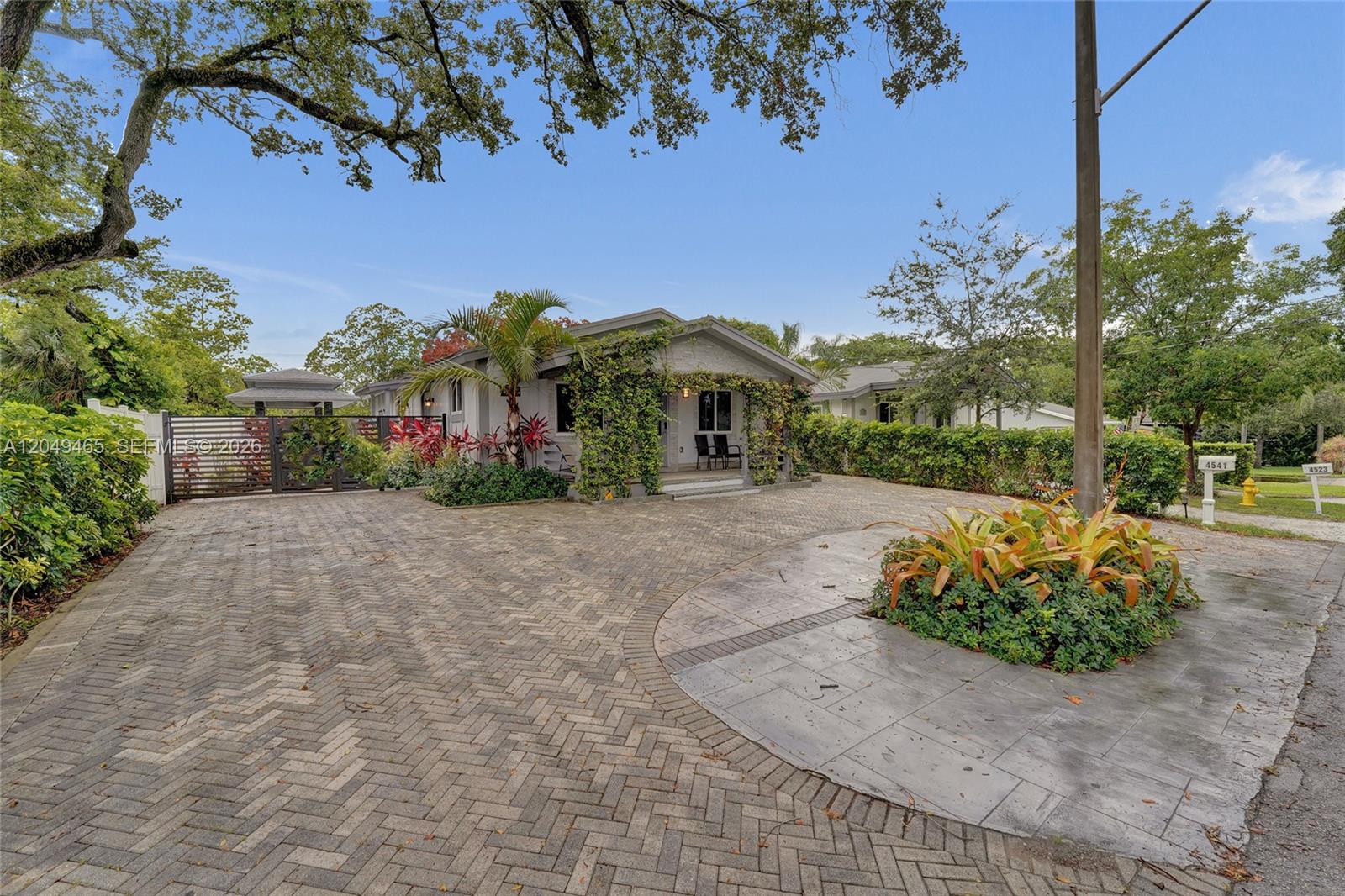 A single-story house with a herringbone brick driveway and a landscaped front yard — 4541 SW 26th Ter # 0, Dania Beach FL 33312, DANIA BEACH, FL
