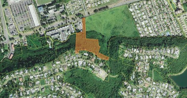 An aerial map shows a highlighted parcel of land surrounded by residential neighborhoods and trees — PR-14 KM 2.2 CERRILLOS HOYOS WARD, PONCE, PR