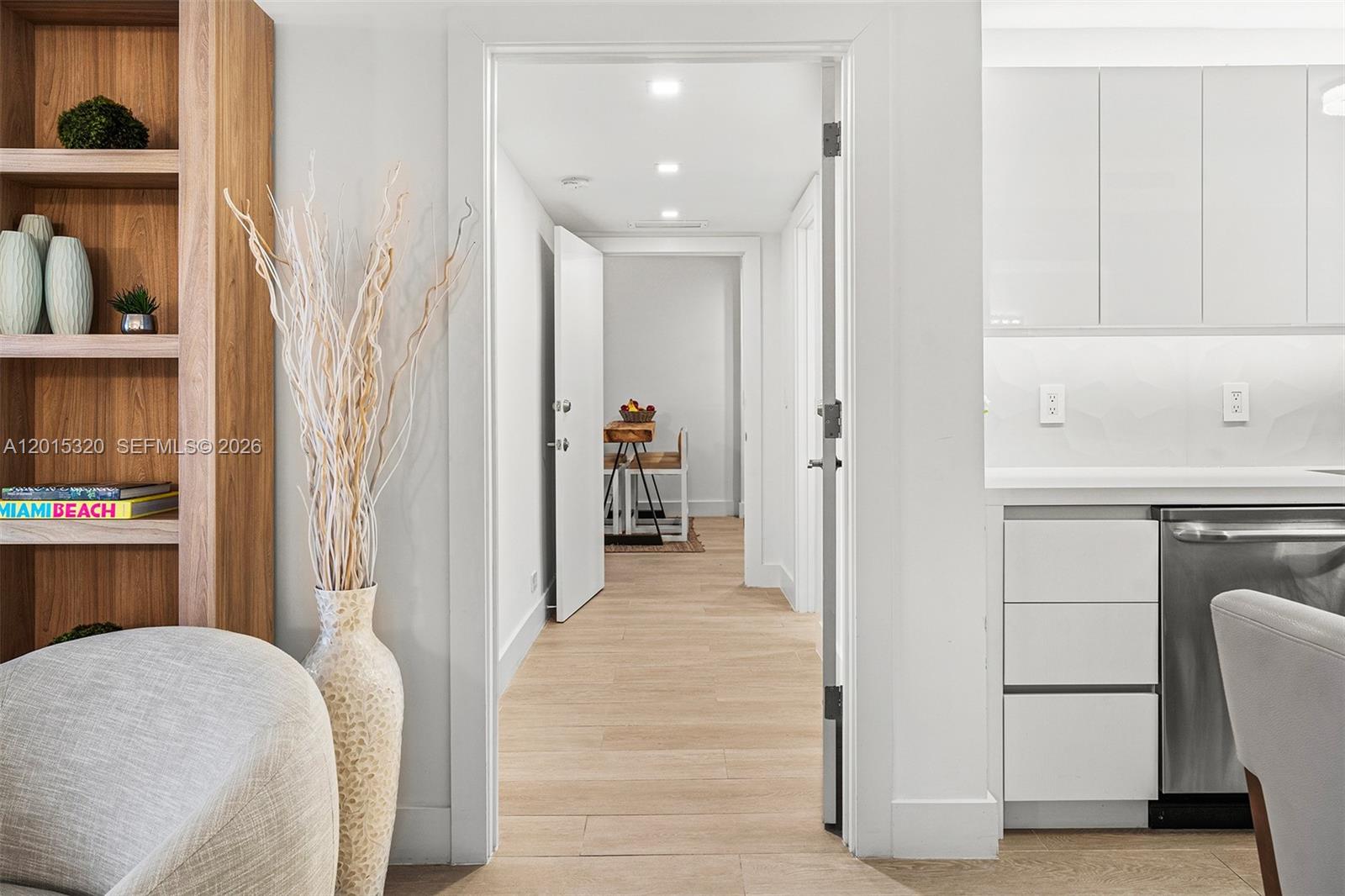 A view through a doorway shows a hallway leading to a dining area — 2301 Collins Ave # 1129, Miami Beach FL 33139, MIAMI BEACH, FL