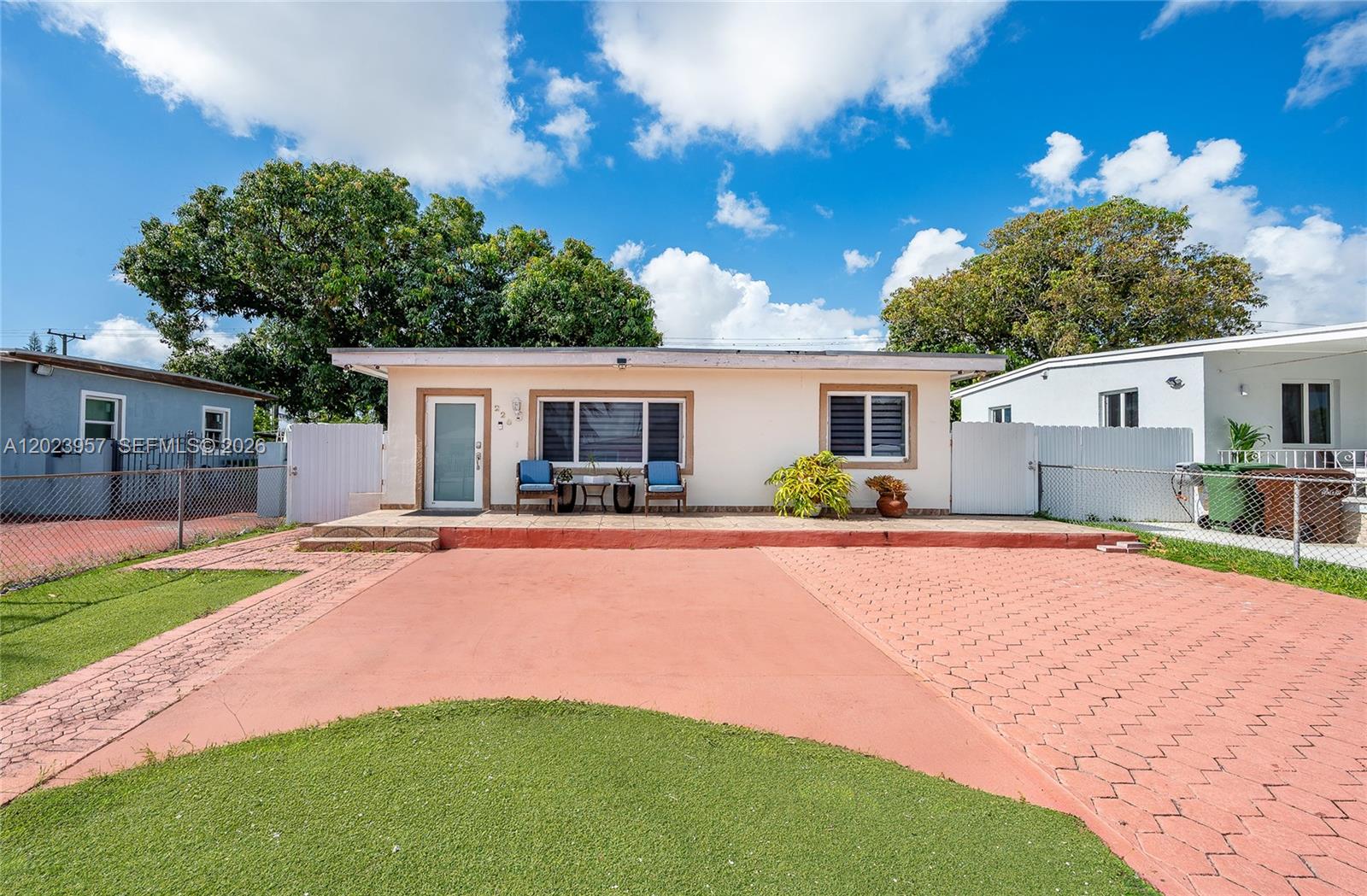 A single-story house with a red paved driveway and a small front porch — 228 W 18th St, Hialeah FL 33010, HIALEAH, FL