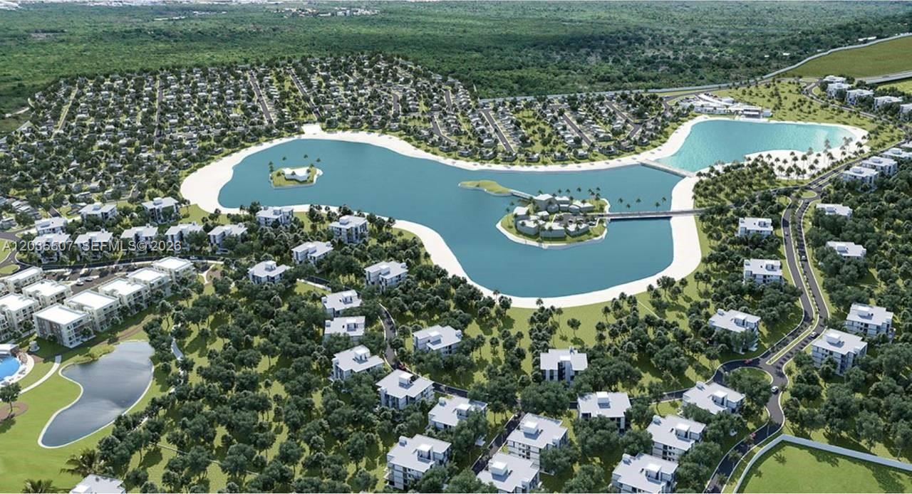 An aerial rendering shows a residential community featuring multiple buildings surrounding a large central lake — 1 terreno # 1, FL