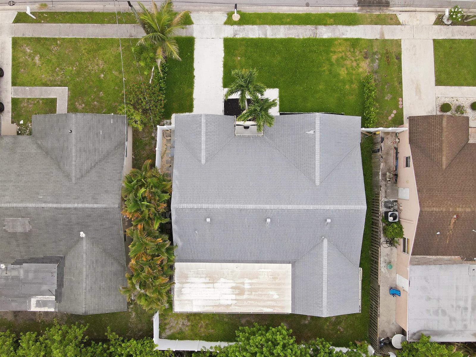 An aerial view shows a house with a gray shingled roof and a rear patio — 22267 SW 57th Avenue, Boca Raton FL 33428, BOCA RATON, FL