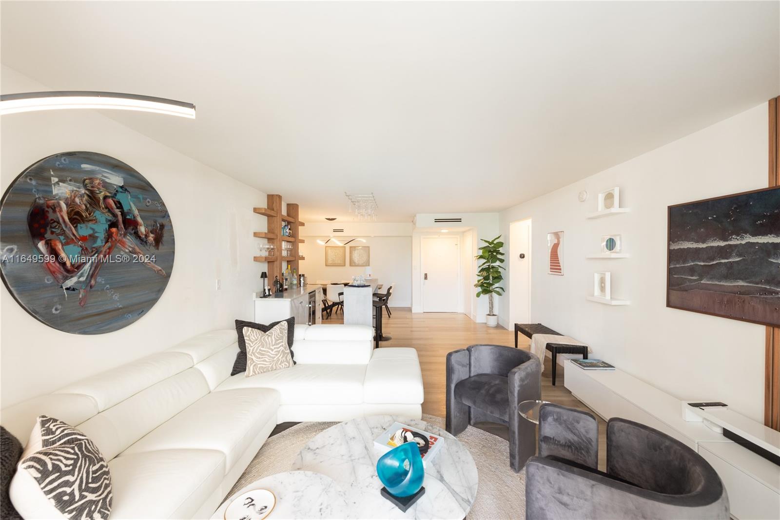A living room features a white sectional sofa, two gray armchairs, and a marble coffee table — 1111 Crandon Blvd # A306, Key Biscayne FL 33149, KEY BISCAYNE, FL