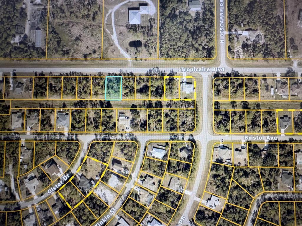 This is an aerial map showing residential lots and streets in a suburban neighborhood — TROPICAIRE BOULEVARD, NORTH PORT, FL