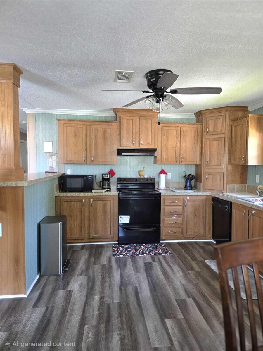 A kitchen features wood cabinets, black appliances, light blue walls, and grey wood-look flooring — 5003 NW 4 Terrace, Deerfield Beach FL 33064, DEERFIELD BEACH, FL
