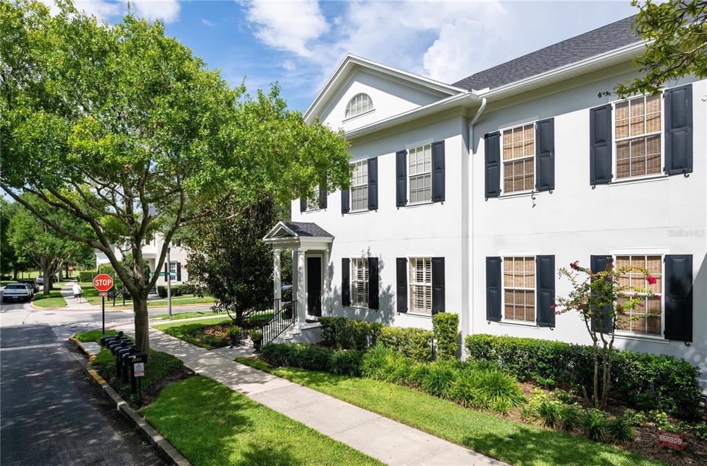 A two-story white building with black shutters and a small covered entryway — 2293 OSPREY AVENUE, ORLANDO, FL