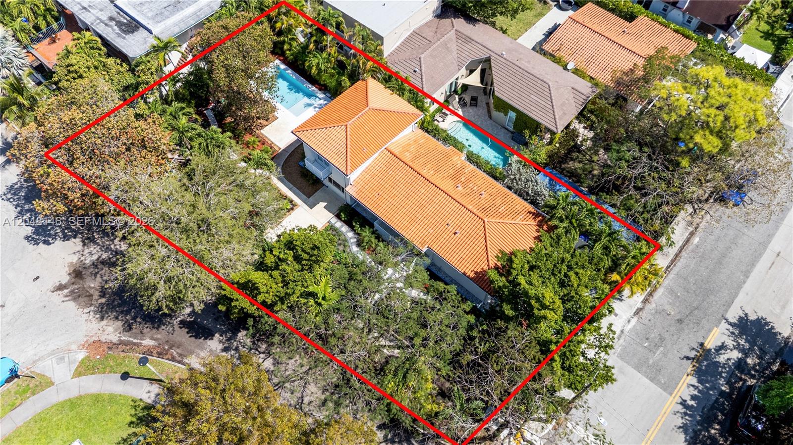 An aerial view shows a house with a red tile roof and a swimming pool — 1345 SW 14th Ave, Miami FL 33145, MIAMI, FL