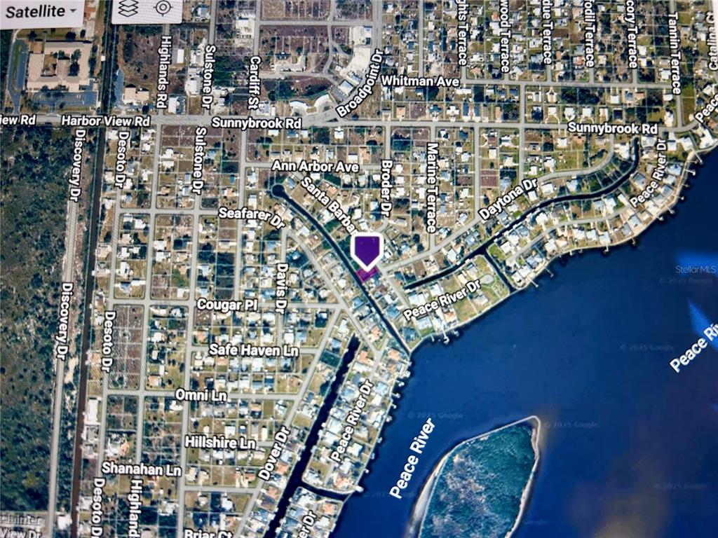 This is a satellite map view of a residential neighborhood near the Peace River — 3285 SANTA BARBARA DR, PUNTA GORDA, FL